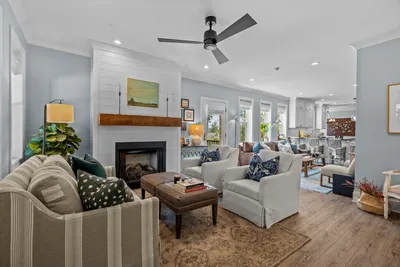 Cozy living room with stone fireplace and built-in shelving
